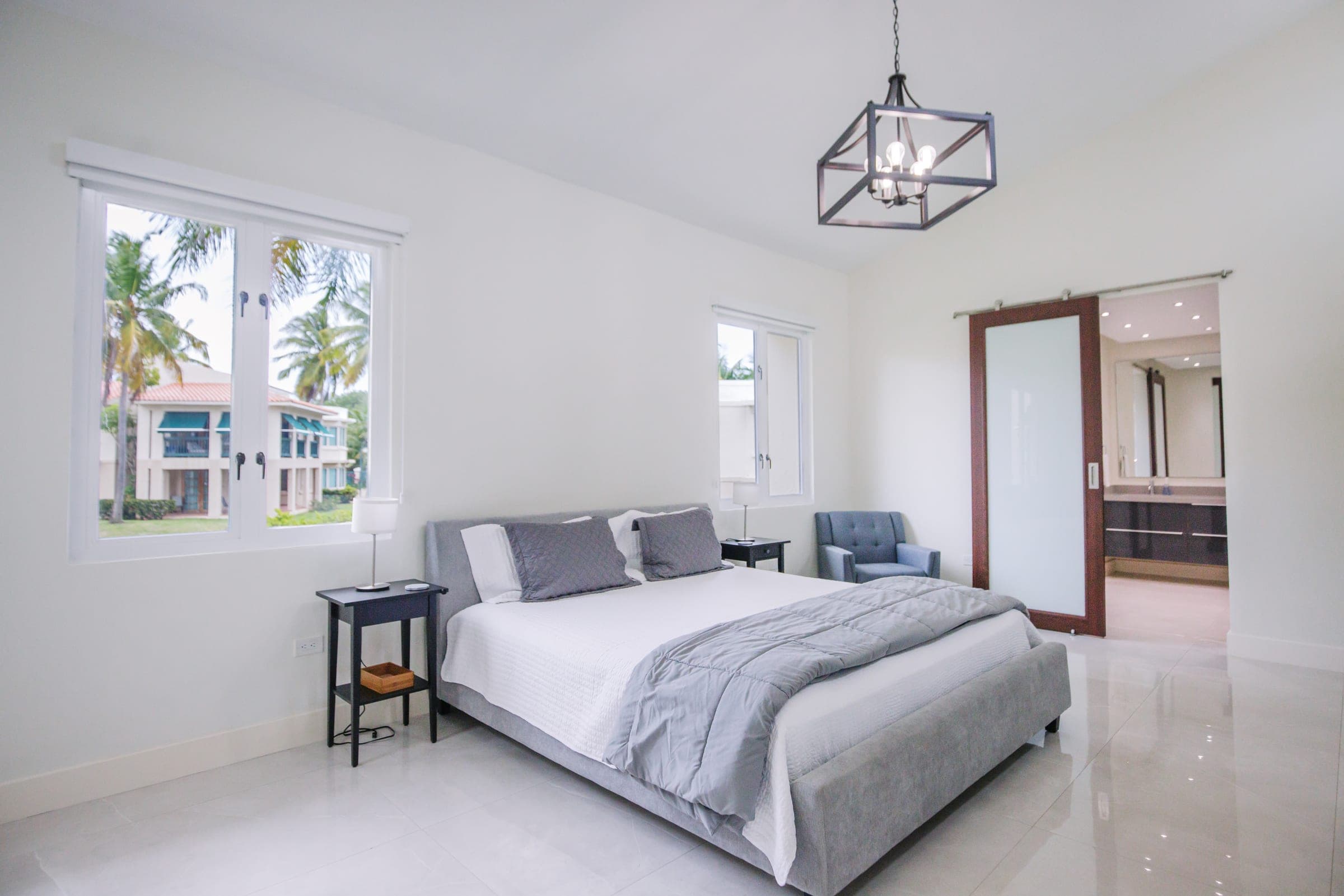 Primary bedroom alternate view with sliding glass door to the en-suite bath